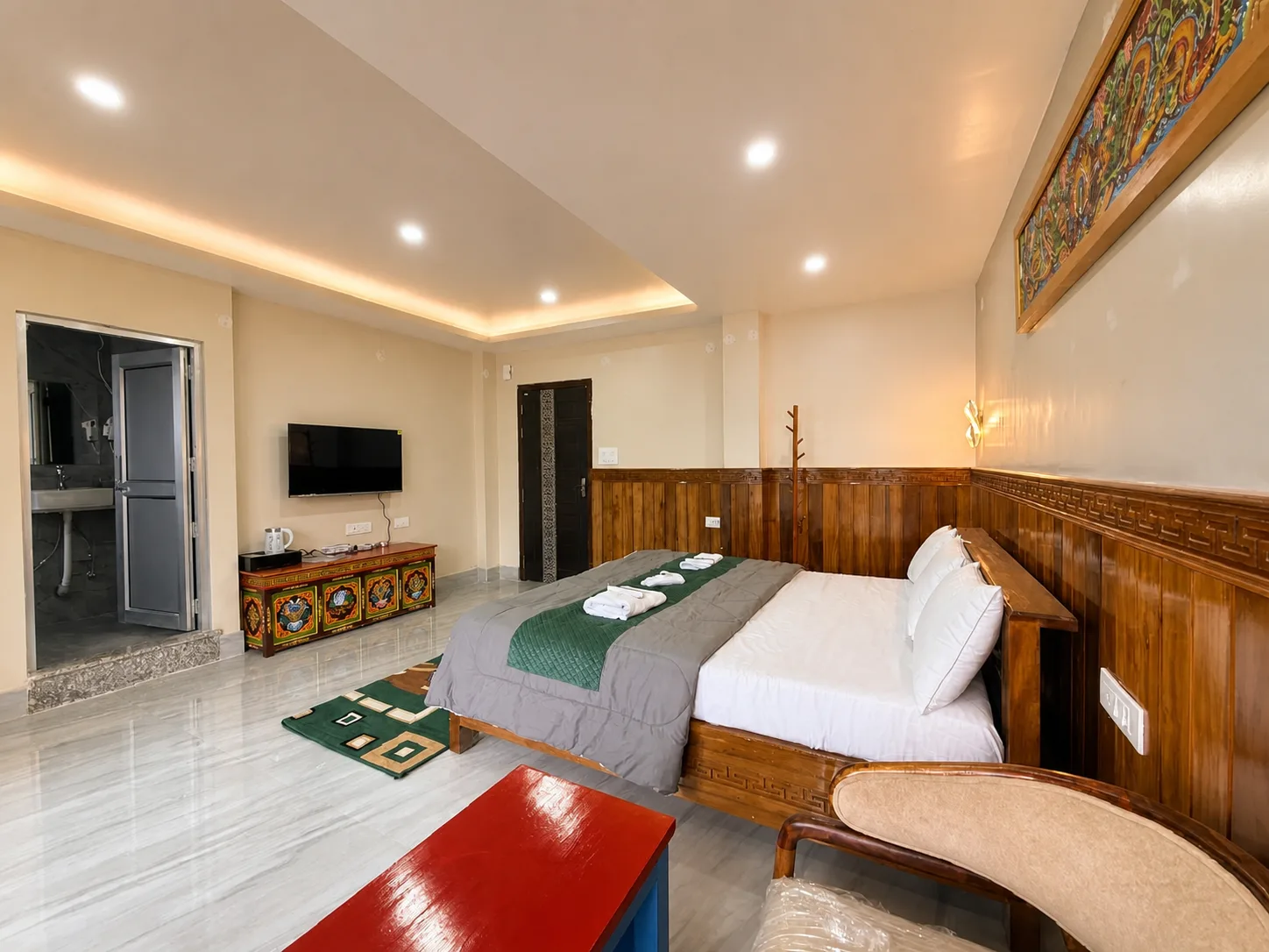 Presidential Suite showing the double bed, television and wooden interior