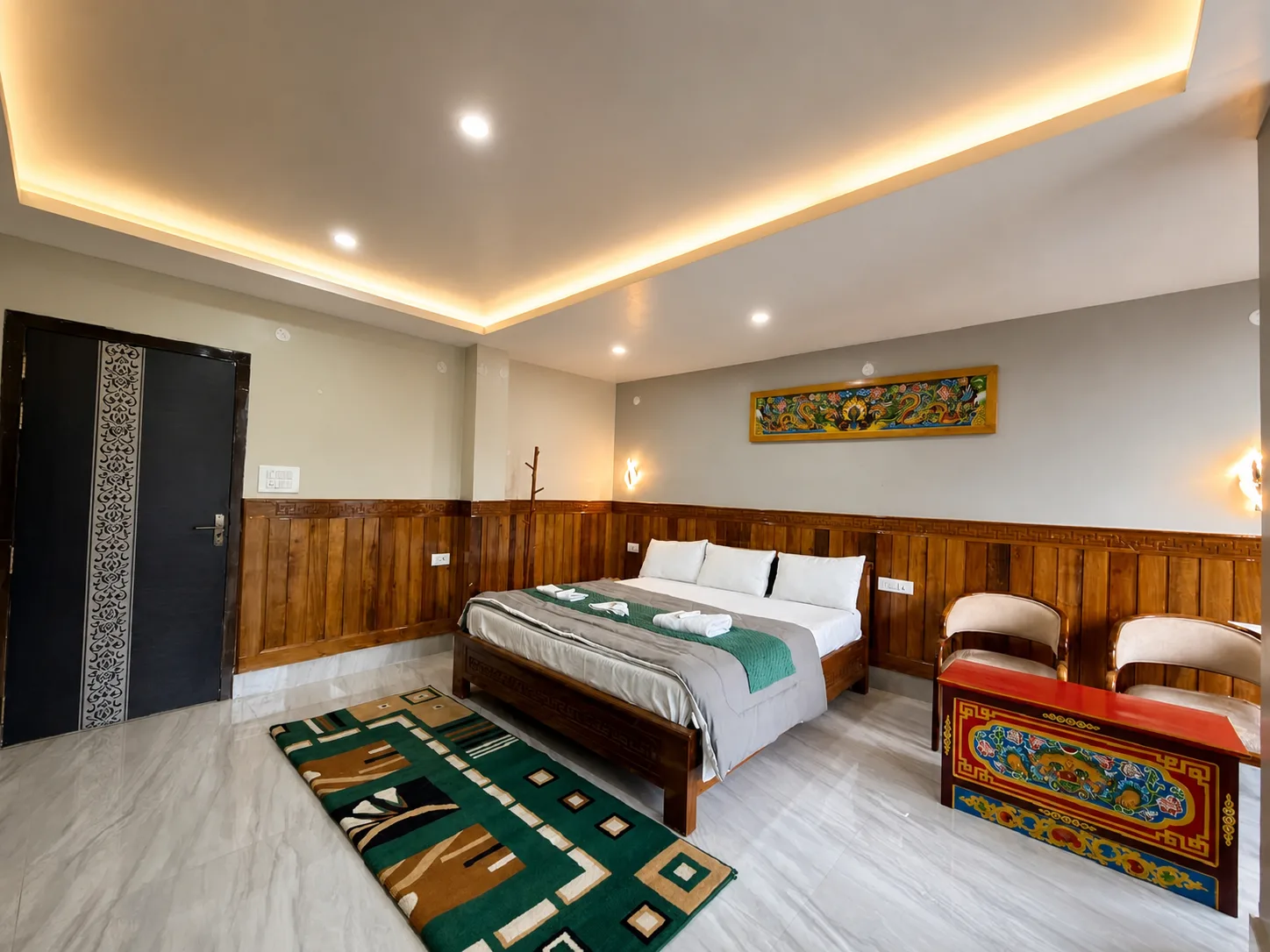 Full Presidential Suite interior with a double bed and sitting area
