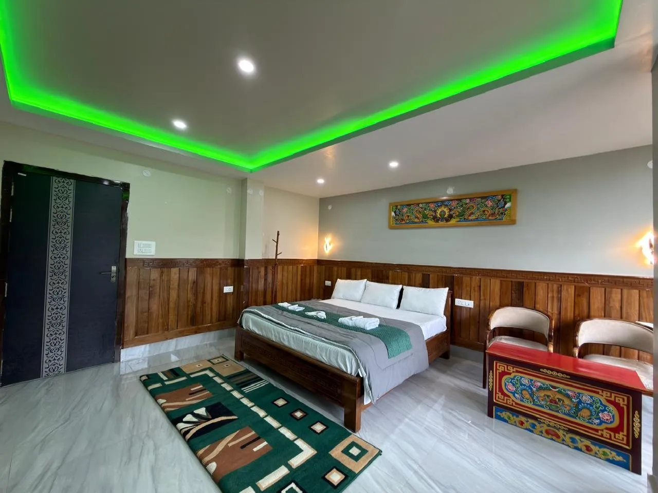 Full Presidential Suite interior with a double bed and sitting area