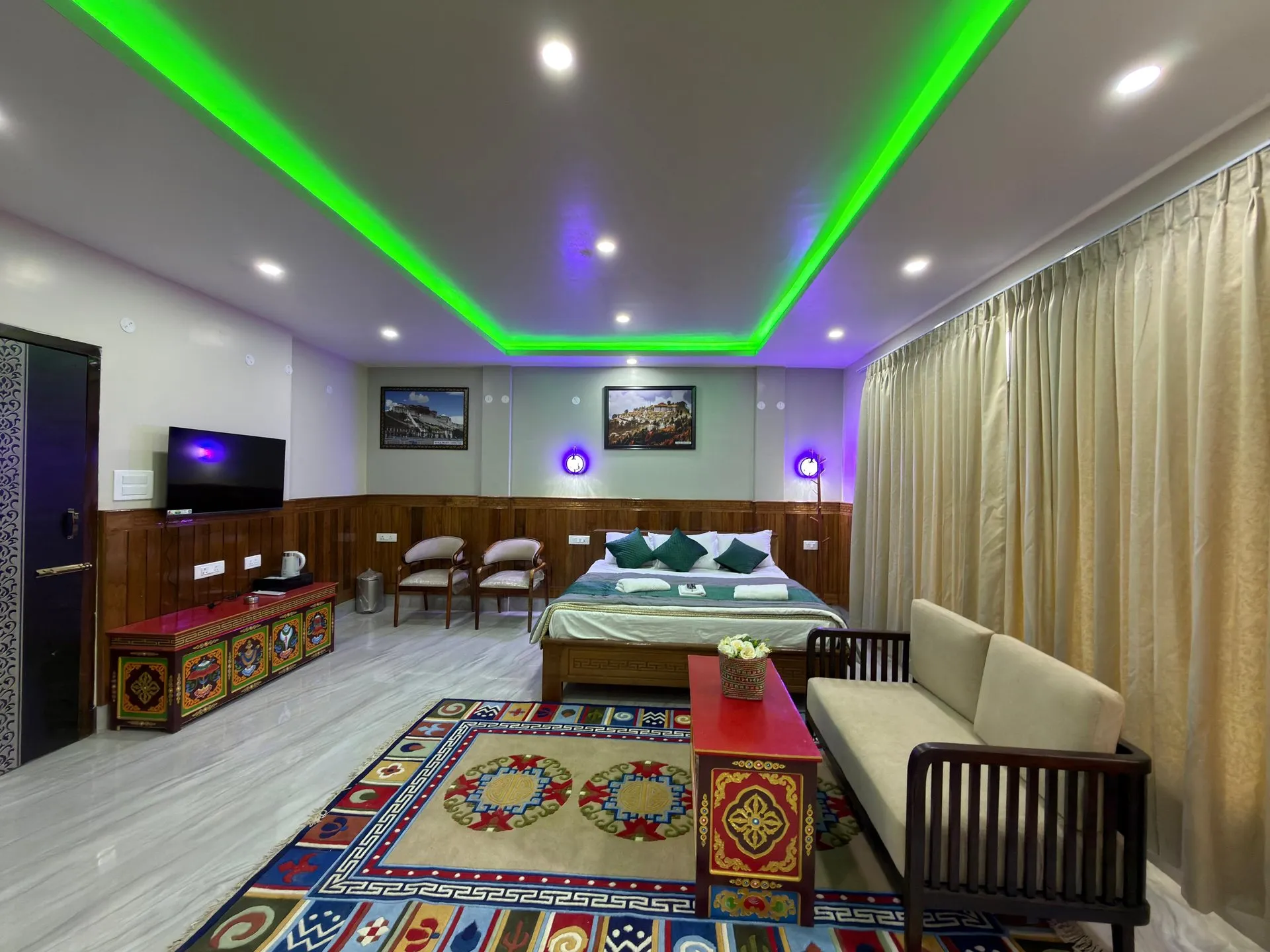 Suite Room layout showing the bed, sofa, carpet and television